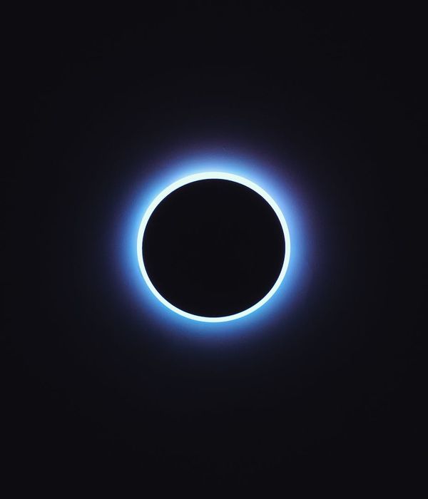 Abstract blue glowing spheres in dark space